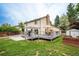 Well-maintained backyard featuring a patio, shed, and mature trees at 4571 S Memphis St, Aurora, CO 80015