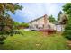 Landscaped backyard featuring a back deck and shed at 4571 S Memphis St, Aurora, CO 80015