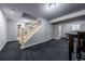 Finished basement with modern staircase at 4571 S Memphis St, Aurora, CO 80015