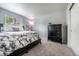 Bedroom with a black bed frame and matching dresser at 4571 S Memphis St, Aurora, CO 80015