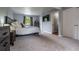 Comfortable bedroom featuring soft carpet, neutral walls, and a flat screen television for relaxing evenings at 4571 S Memphis St, Aurora, CO 80015