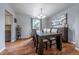 Elegant dining room with hardwood floors, modern chandelier, and sophisticated decor at 4571 S Memphis St, Aurora, CO 80015