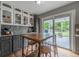 Eat-in kitchen with a granite countertop, breakfast bar, and bright cabinets at 4571 S Memphis St, Aurora, CO 80015
