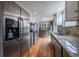 Spacious kitchen with stainless steel appliances, granite countertops, and ample storage space at 4571 S Memphis St, Aurora, CO 80015