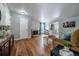 Inviting living room with hardwood floors, a brick fireplace, and cozy seating area at 4571 S Memphis St, Aurora, CO 80015