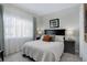 Cozy bedroom with lots of natural light, bedside tables with lamps, and neutral color scheme at 6283 Kilmer Loop # 201, Golden, CO 80403