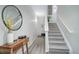 Hallway featuring a stairway, wood flooring, decor, and natural light at 6283 Kilmer Loop # 201, Golden, CO 80403