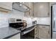 Close up of a kitchen showcasing updated appliances, sleek countertops, and bright, modern design at 6283 Kilmer Loop # 201, Golden, CO 80403