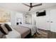 Spacious bedroom with a queen bed and ceiling fan at 12555 W 61St Ave, Arvada, CO 80004