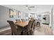 Dining area with wood table and chairs, adjacent to kitchen at 12555 W 61St Ave, Arvada, CO 80004