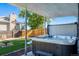 Relaxing hot tub on covered patio overlooking backyard at 12555 W 61St Ave, Arvada, CO 80004