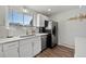 Clean kitchen with white cabinets and quartz countertops at 12555 W 61St Ave, Arvada, CO 80004