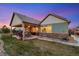 Charming home features a beautiful backyard, patio, and landscaped lawn, perfect for outdoor enjoyment at 23600 E Swallow Cir, Aurora, CO 80016