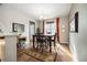 Traditional dining room with hardwood floors, large window, and classic decor at 23600 E Swallow Cir, Aurora, CO 80016