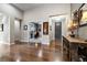 Inviting foyer showcasing hardwood floors, a view of the office, and stylish decor at 23600 E Swallow Cir, Aurora, CO 80016