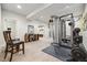 Bright home gym featuring a weight machine, neutral paint, and carpeted floors at 23600 E Swallow Cir, Aurora, CO 80016