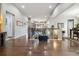 Open concept living area with hardwood floors and views of the dining room at 23600 E Swallow Cir, Aurora, CO 80016