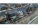 Aerial view of home showcasing the backyard oasis with firepit, and a well manicured lawn at 14845 Haley Ave, Parker, CO 80134