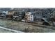 Aerial view of homes in a neighborhood featuring a fenced yard with fire pit and trampoline at 14845 Haley Ave, Parker, CO 80134