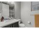 Bathroom featuring vanity with stone countertop and tiled shower at 14845 Haley Ave, Parker, CO 80134