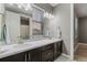 Bathroom with double sink, mosaic backsplash and view of the mountains at 14845 Haley Ave, Parker, CO 80134