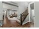 Hallway and staircase leading to living room with large window at 14845 Haley Ave, Parker, CO 80134