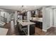 Well-equipped kitchen featuring stainless steel appliances, granite countertops, and dark wood cabinets at 14845 Haley Ave, Parker, CO 80134