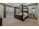 Main bedroom featuring four poster bed, neutral walls, and large windows at 14845 Haley Ave, Parker, CO 80134