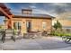 Community patio area offering a lovely place to relax, enhanced by a stone fireplace at 14845 Haley Ave, Parker, CO 80134