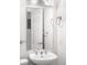 Elegant bathroom features modern fixtures, a sleek vanity, and a well-lit mirror at 1780 N Washington St # 305, Denver, CO 80203