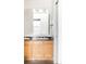Bathroom featuring dual sinks, a large mirror, and modern fixtures that create a functional and well-lit space at 1780 N Washington St # 305, Denver, CO 80203