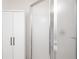 Bathroom featuring a white cabinet and a frosted shower door for privacy at 1780 N Washington St # 305, Denver, CO 80203