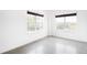 Bright bedroom featuring concrete floors, neutral walls, and multiple windows offering plenty of natural light at 1780 N Washington St # 305, Denver, CO 80203