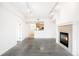 Bright living space opens to the kitchen with modern floors and fireplace at 1780 N Washington St # 305, Denver, CO 80203