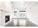 Bright, open living space with modern floors, fireplace, and large windows at 1780 N Washington St # 305, Denver, CO 80203