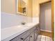 Bathroom featuring an extended vanity with ample counter space and a mirror at 2710 Zenobia St, Denver, CO 80212