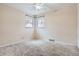 Bright bedroom with plush carpet, neutral walls, and dual windows providing ample natural light at 2710 Zenobia St, Denver, CO 80212