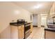 Functional kitchen featuring stainless steel appliances, tile flooring, and ample counter space at 2710 Zenobia St, Denver, CO 80212