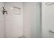 Modern walk-in shower with subway tile and sleek glass doors at 2710 Zenobia St, Denver, CO 80212