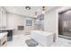 Spacious bath featuring a soaking tub, tile floors, shower and custom vanity at 463 Locust St, Denver, CO 80220