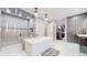 Bathroom featuring a soaking tub, shower, tile floors and custom cabinetry at 463 Locust St, Denver, CO 80220
