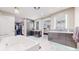 Beautiful bathroom featuring a soaking tub, custom cabinetry, and and vanities at 463 Locust St, Denver, CO 80220