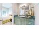 Bathroom featuring green vanity with granite countertop and a view of the bedroom at 463 Locust St, Denver, CO 80220
