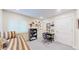 Bedroom with a twin bed and a desk, complemented by neutral walls and carpet at 463 Locust St, Denver, CO 80220