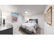 Cozy bedroom with dark furniture, soft lighting, and a neutral patterned duvet at 463 Locust St, Denver, CO 80220