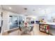 Bright dining area adjacent to the kitchen, featuring a glass table, and outdoor access at 463 Locust St, Denver, CO 80220