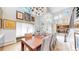 Dining room with tall ceilings, modern chandeliers, and gallery wall at 463 Locust St, Denver, CO 80220
