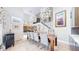Elegant dining room with modern light fixtures, staircase, and an open floor plan at 463 Locust St, Denver, CO 80220