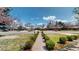 Charming home featuring a well-manicured front yard and a long walkway at 463 Locust St, Denver, CO 80220
