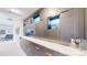 Hallway featuring a built-in cabinetry with accent lighting and marble countertops at 463 Locust St, Denver, CO 80220